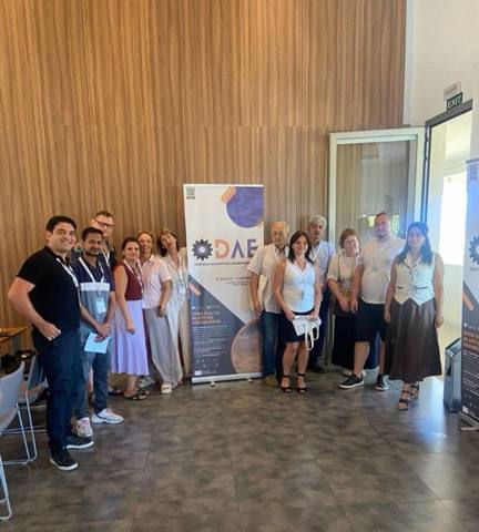 Consortium members next to the ODAE 2026 banner
